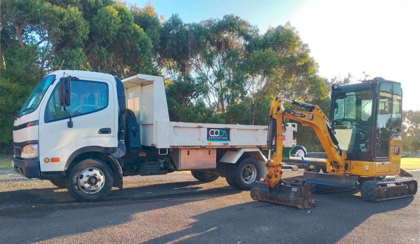 Photo of excavator on dirt